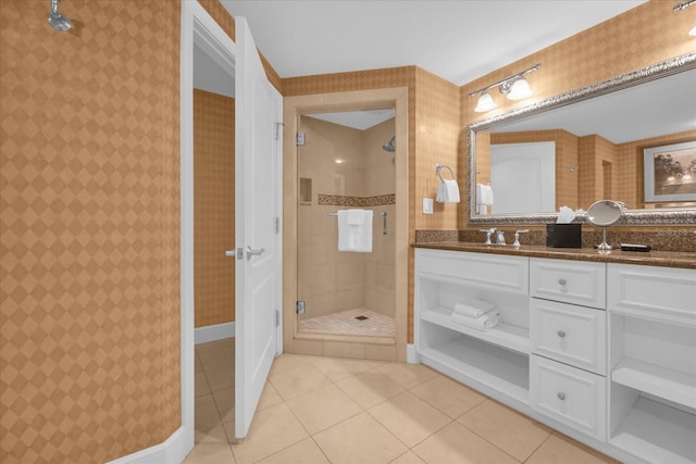 bathroom featuring tile patterned floors, vanity, and an enclosed shower