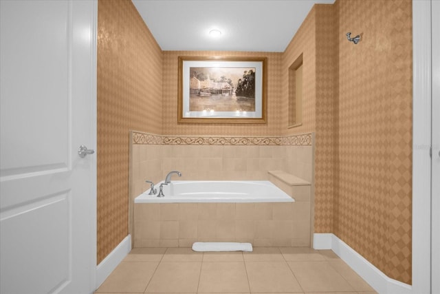 bathroom featuring tile patterned floors and a relaxing tiled tub