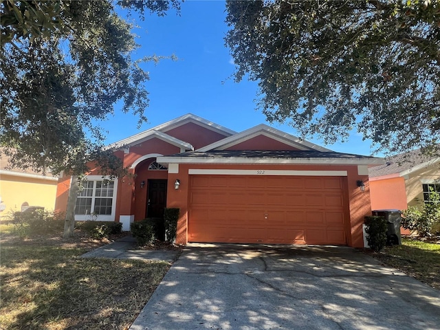 ranch-style home featuring a garage