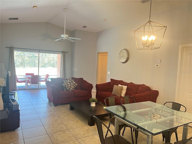 living room featuring ceiling fan with notable chandelier, light tile patterned flooring, and high vaulted ceiling