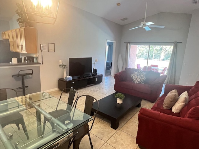 tiled living room featuring ceiling fan and high vaulted ceiling