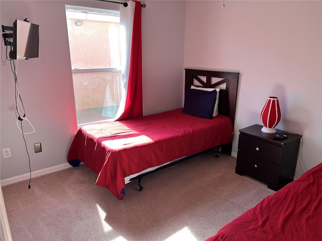 bedroom with light carpet