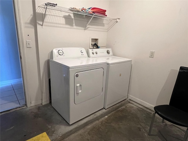 laundry room featuring washing machine and clothes dryer