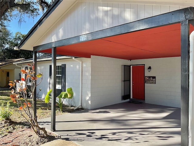 entrance to property featuring a carport