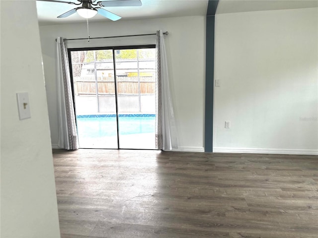 unfurnished room with ceiling fan and dark hardwood / wood-style floors