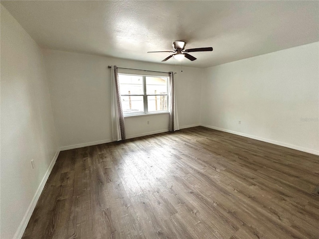 empty room featuring hardwood / wood-style flooring, ceiling fan, and a textured ceiling