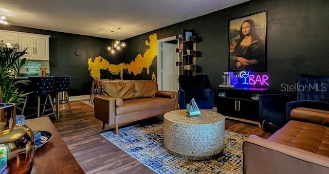 living room with dark wood-type flooring