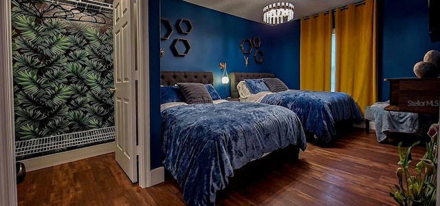 bedroom featuring dark wood-type flooring