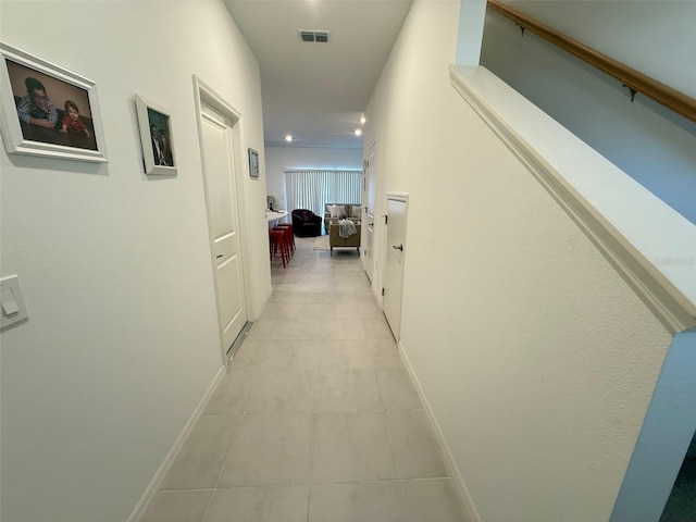 hallway featuring light tile patterned floors