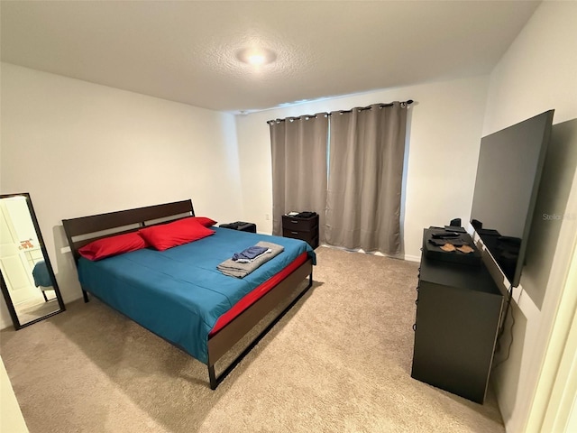 carpeted bedroom with a textured ceiling