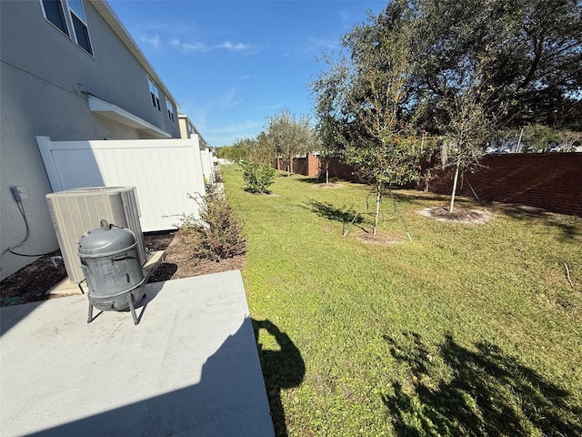 view of yard featuring a patio area and cooling unit