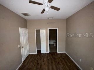 unfurnished bedroom featuring a closet, ceiling fan, and dark hardwood / wood-style flooring