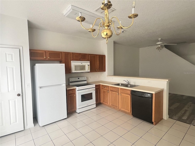 kitchen featuring ceiling fan with notable chandelier, white appliances, sink, and light tile patterned floors