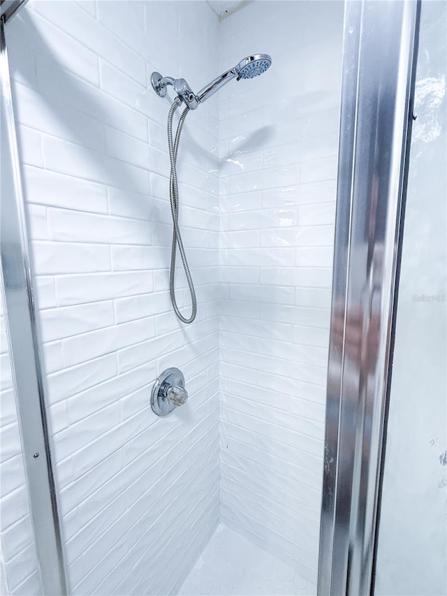 bathroom with tiled shower