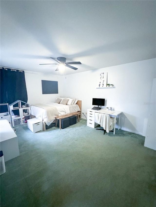 bedroom with dark colored carpet and ceiling fan