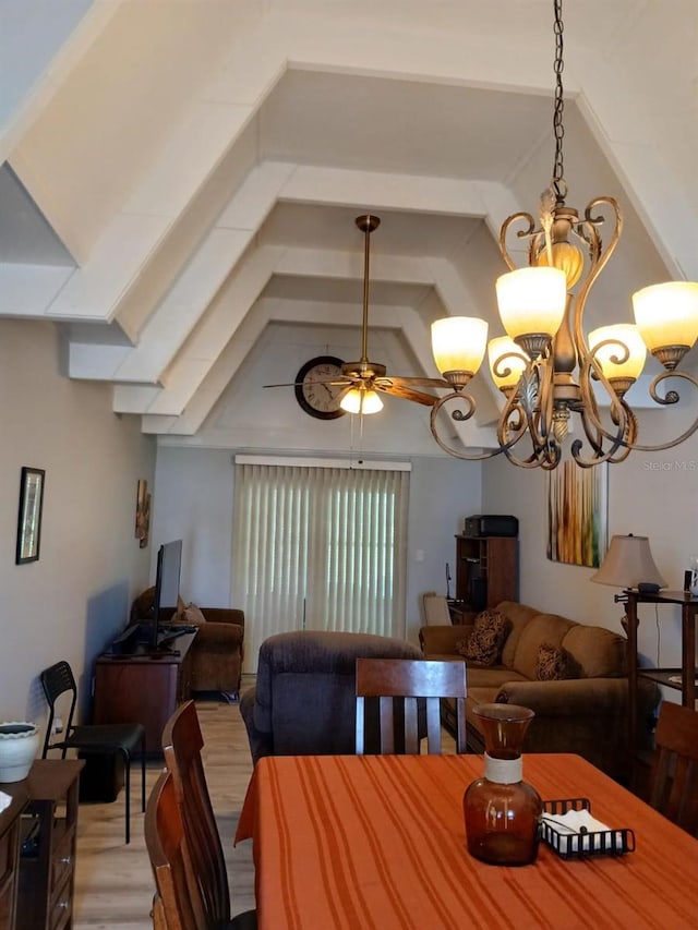 dining space with vaulted ceiling with beams, light hardwood / wood-style floors, and ceiling fan with notable chandelier