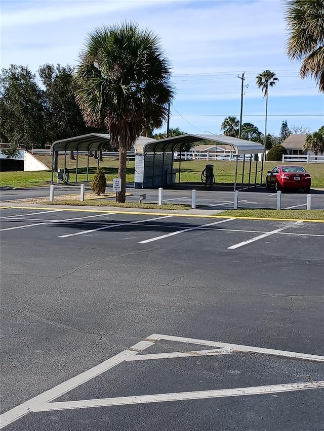 view of vehicle parking featuring a carport