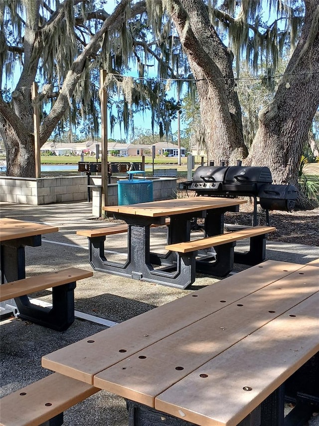 view of property's community with a patio area