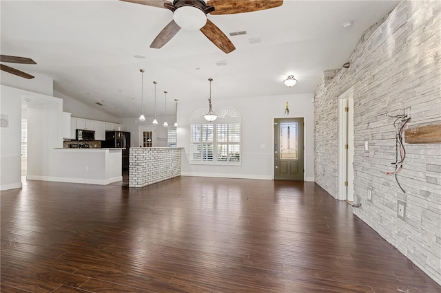 unfurnished living room with ceiling fan, high vaulted ceiling, and dark wood-type flooring