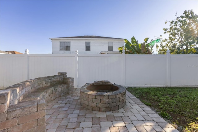 view of patio / terrace featuring an outdoor fire pit