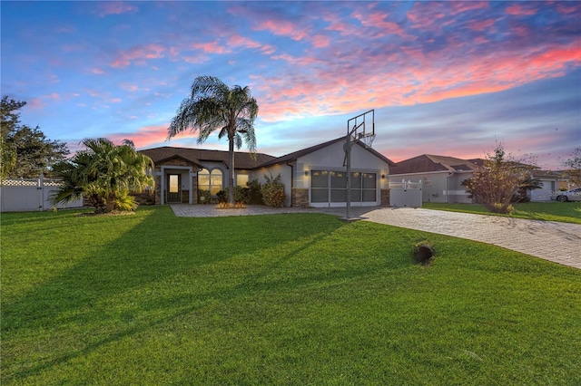 ranch-style house with a lawn