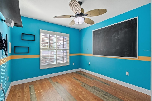 unfurnished room with wood-type flooring and ceiling fan