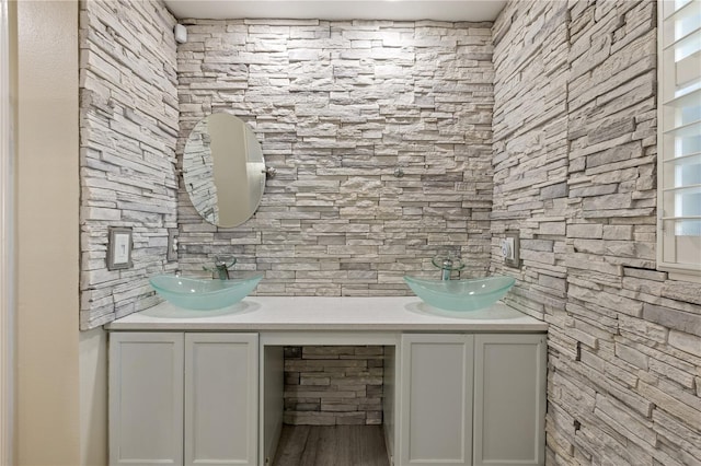 bathroom with hardwood / wood-style floors and vanity