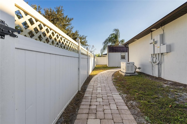 view of home's exterior with a storage unit