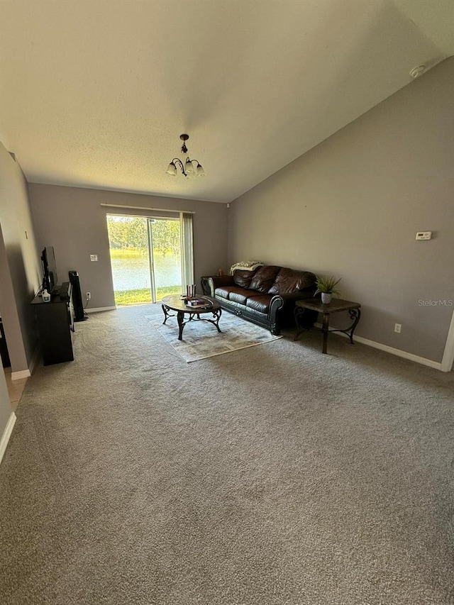 unfurnished living room with light carpet and vaulted ceiling