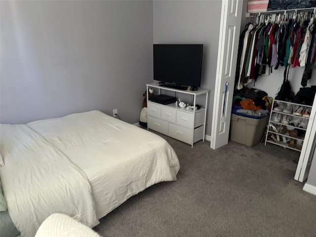 carpeted bedroom with a closet