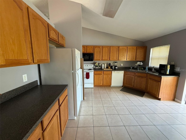 kitchen with sink, white appliances, lofted ceiling, and light tile patterned flooring