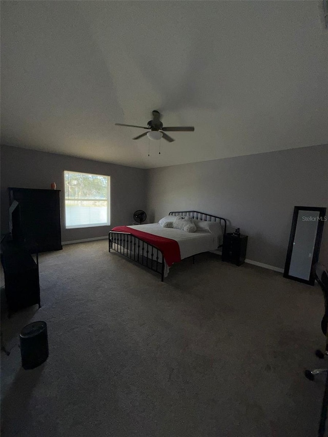 unfurnished bedroom featuring ceiling fan and carpet floors