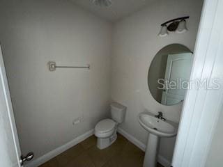 bathroom with toilet and sink