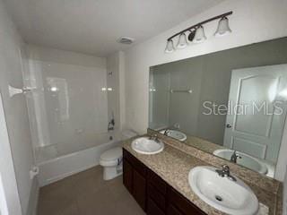 full bathroom featuring shower / tub combination, vanity, and toilet