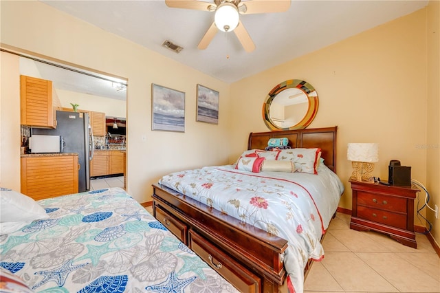 tiled bedroom with ceiling fan