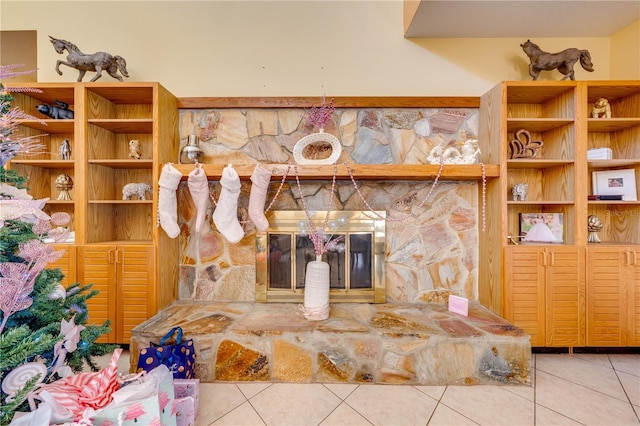 room details featuring a stone fireplace