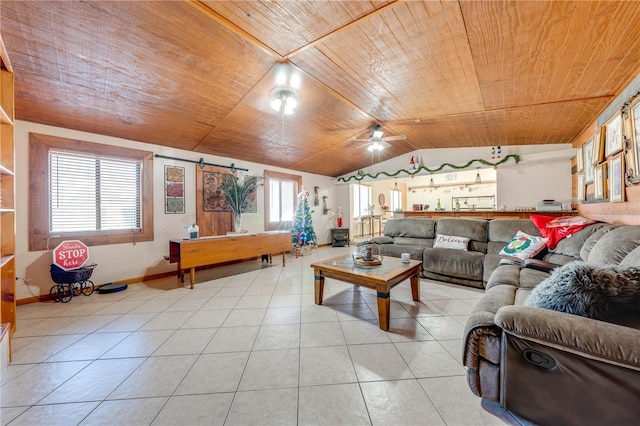 living room featuring ceiling fan, wooden ceiling, a barn door, lofted ceiling, and light tile patterned floors