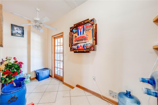 entryway with ceiling fan, light tile patterned floors, a textured ceiling, and french doors