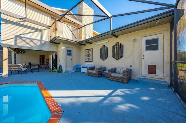 view of swimming pool with glass enclosure and a patio area