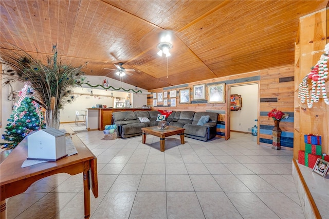 living room with tile patterned floors, ceiling fan, wooden ceiling, and wood walls