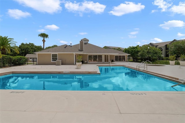 view of swimming pool with a patio and central AC