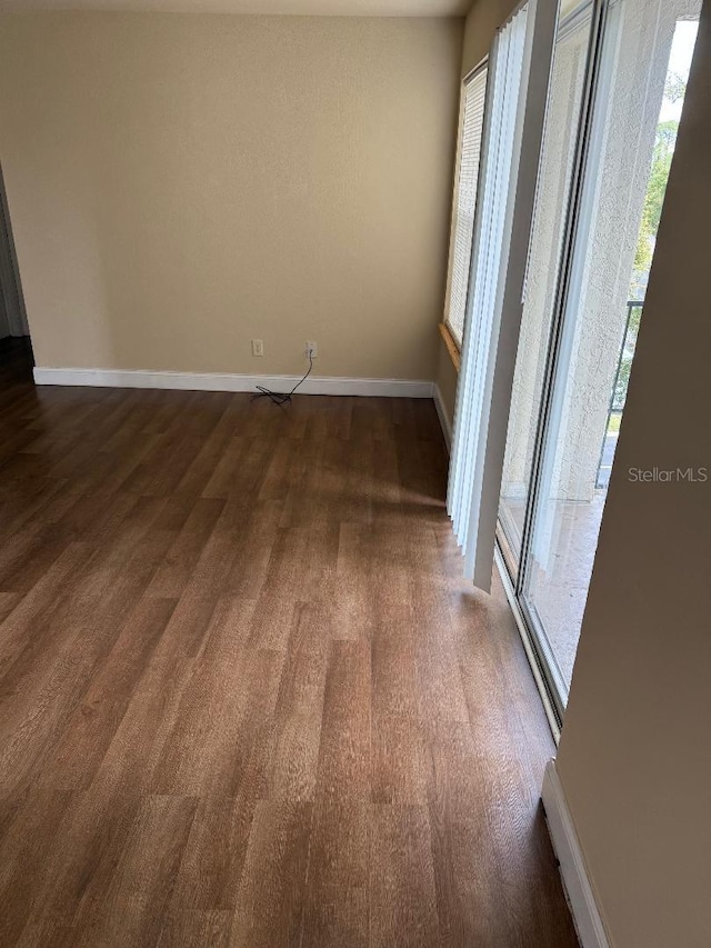 spare room featuring dark hardwood / wood-style floors