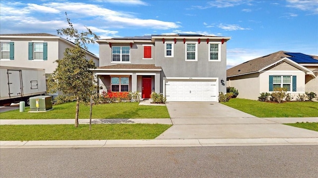 view of front of home featuring solar panels, a garage, and a front lawn