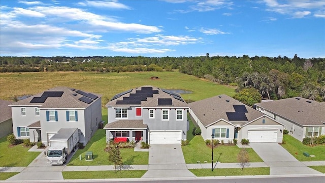 view of front of house with a garage and solar panels