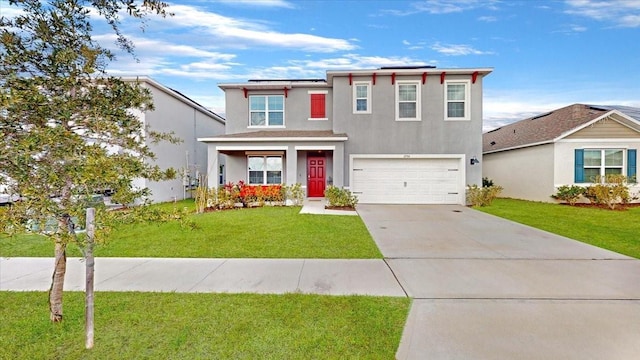 view of front of property featuring a garage and a front lawn