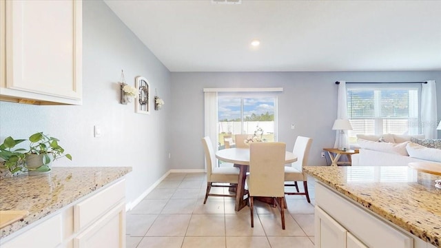 dining area featuring a healthy amount of sunlight and light tile patterned flooring