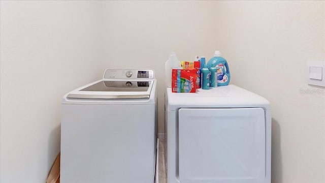 washroom with washing machine and clothes dryer