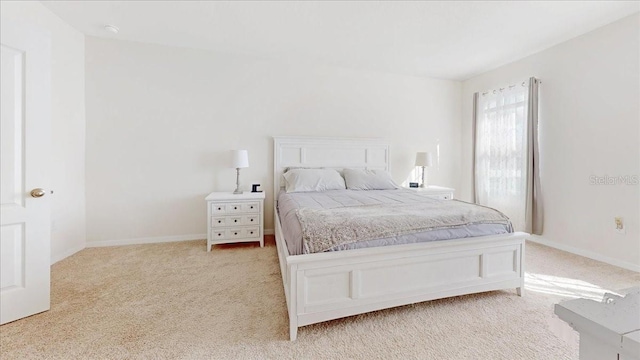 bedroom with light carpet