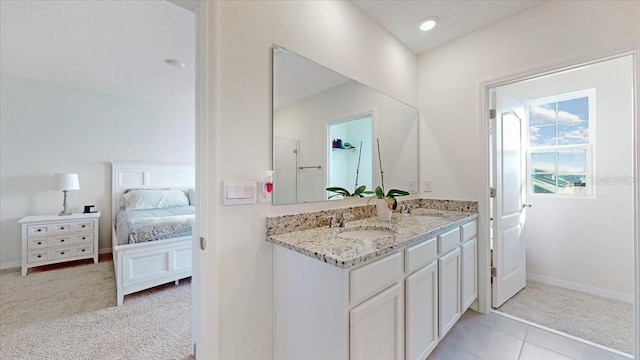 bathroom featuring tile patterned flooring and vanity