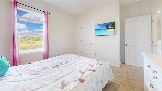 bedroom featuring light colored carpet